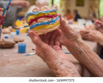 Senior activity concept. Workshop for clay sticking for seniors, glazing and painting clay figurines. Poland. - Shutterstock ID 1634997373