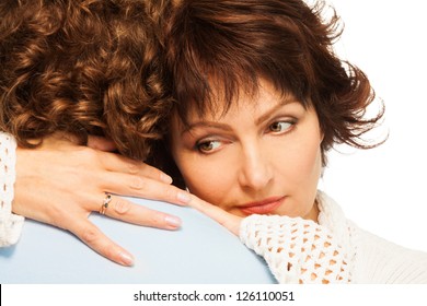 Senior Adult Couple With A Bit Sad Wife Hugging His Husband