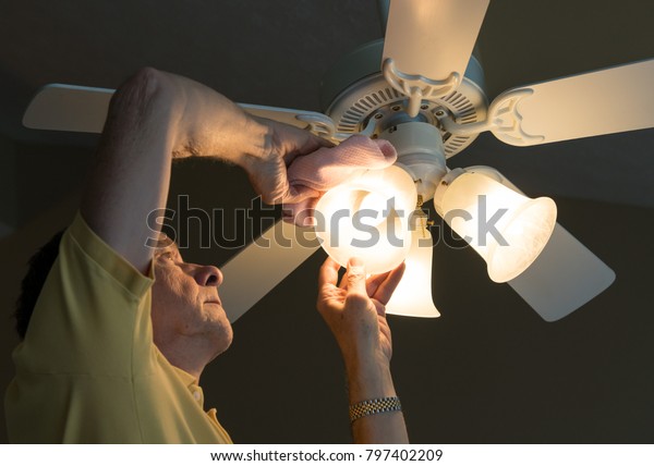 Senior Adult Male Dusting Glass Shade Stock Photo Edit Now