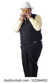 A Senior Adult Man Playing His Harmonica.  On A White Background.