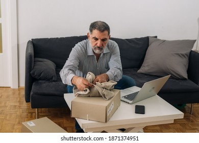 Senior Adult Man Shopping Online From His Home