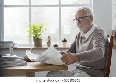 Senior Adult Reading Newspaper Leisure Concept - Powered by Shutterstock