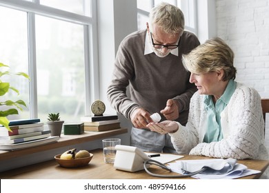 Senior Adult Taking Pills Medicine Concept