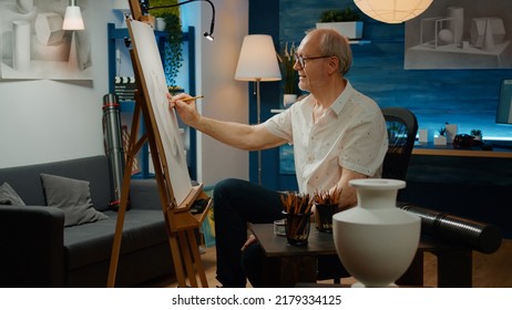 Senior Adult Using Pencils To Draw Vase On White Canvas, Creating Professional Artwork Sketch With Inspiration Model. Authentic Design And Drawing With Artistic Skills For Art And Craft Hobby.