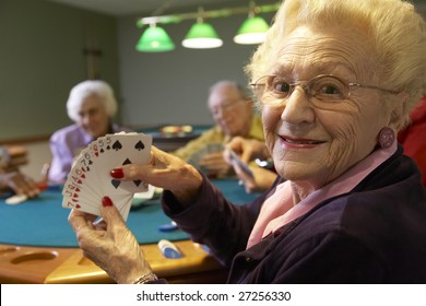 Senior adults playing bridge