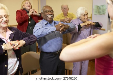 Senior Adults In A Stretching Class