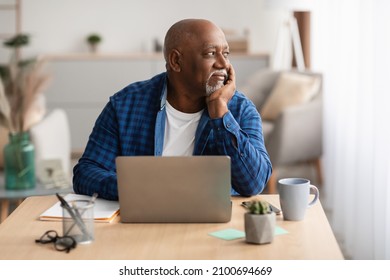 Senior African American Business Man At Laptop Sitting Looking Aside Working Online In Modern Office Indoor. Mature Male Freelancer Using Computer At Workplace. Entrepreneurship And Freelance