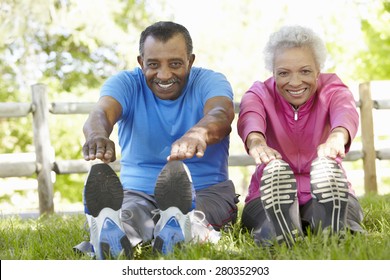 Senior African American Couple Exercising In Park - Powered by Shutterstock