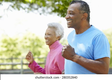 Senior African American Couple Jogging In Park