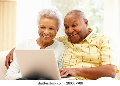 Senior African American couple using laptop