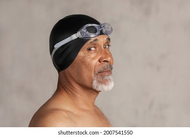 Senior African American Swimmer Wearing A Swim Cap And Goggles