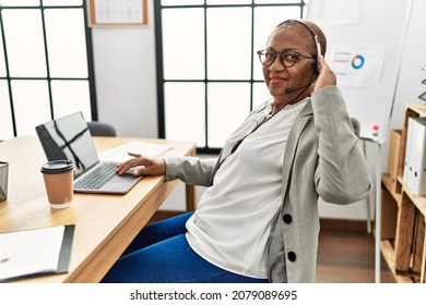 Senior African American Woman Call Center Agent Working At Office