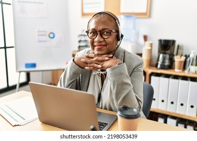 Senior African American Woman Call Center Agent Working At Office