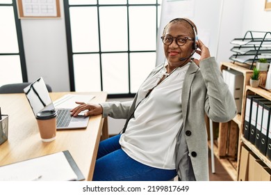 Senior African American Woman Call Center Agent Working At Office