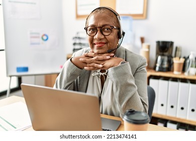 Senior African American Woman Call Center Agent Working At Office