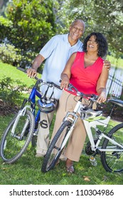 A senior African American woman & man couple riding bicycles in the summer