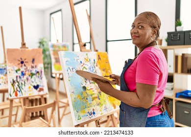 Senior african american woman smiling confident drawing at art studio - Powered by Shutterstock