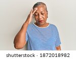 Senior african american woman wearing casual clothes surprised with hand on head for mistake, remember error. forgot, bad memory concept. 