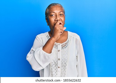 Senior african american woman wearing casual clothes feeling unwell and coughing as symptom for cold or bronchitis. health care concept.  - Powered by Shutterstock