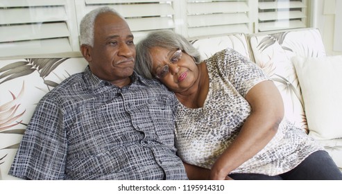 Senior African Couple Relaxing On A Couch