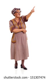 senior african woman pointing isolated on white background