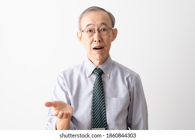 Senior Asian Businessman Talking Looking At Camera Isolated On White Background