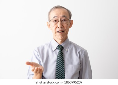 Senior Asian Businessman Talking Looking At Camera Isolated On White Background