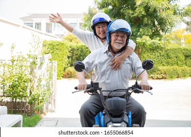 Senior Asian Couple Riding Motorcycle, Happy Active Old Age And Lifestyle Concept