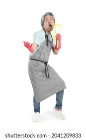 The Senior Asian Housekeeper Standing On The White Background.