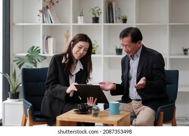 Senior Asian Man Meeting Financial Adviser For Investment, Financial Advisor Talks With Client For Financial Planning After Retirement