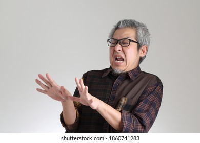 The Senior Asian Man Standing On The White Background