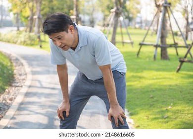 Senior Asian man Tried or Exhausted, panting, cardiac arrest running senior man, outdoor park
 - Powered by Shutterstock