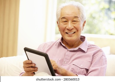 Senior Asian Man Using Tablet