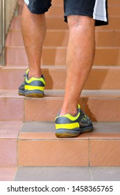 Senior Asian Man Walking Up Stairs In The Housing Estate. Retirement And Health Concept.