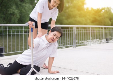 Senior Asian Woman With Faint Sitting On Floor After Falling Down,Women Take Care And Support,Older People Falling