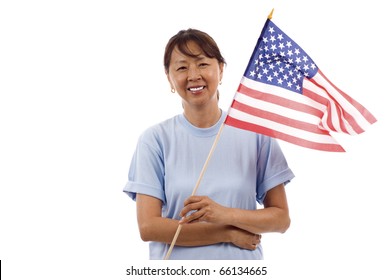 Senior Asian Woman Wearing A  Blank Blue Shirt, Holding An American Flag Isolated Over White Background