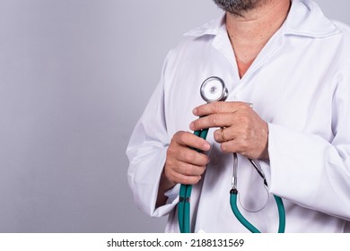 Senior attractive Brazilian doctor in a white coat, no face - Shutterstock ID 2188131569