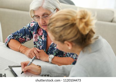 senior with banker meeting about contracting new credit