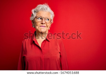 Similar – Image, Stock Photo Elderly woman in yellow top with a warm smile