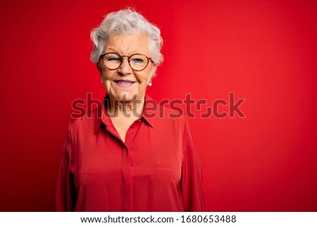 Similar – Image, Stock Photo Elderly woman in yellow top with a warm smile