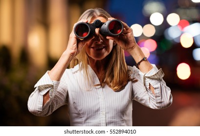 senior beautiful woman with binoculars