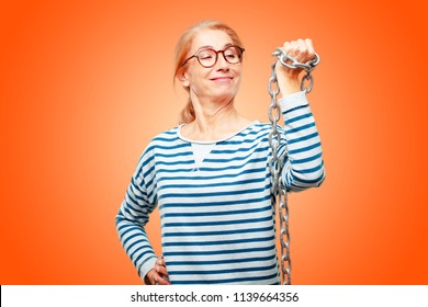 senior beautiful woman with a chain. freedom concept - Shutterstock ID 1139664356