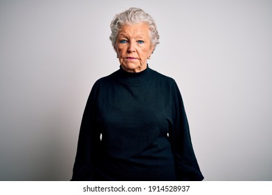 Senior Beautiful Woman Wearing Casual Black Sweater Standing Over Isolated White Background Depressed And Worry For Distress, Crying Angry And Afraid. Sad Expression.