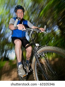 Senior Biking On A Mountain Bike