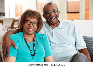 Senior Black Couple Sitting At Home, Smiling To Camera, Close Up