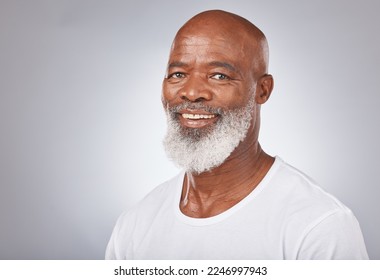 Senior black man, face and self care with skincare, dermatology and cosmetics for clean, glow and fresh skin. Portrait of African male with a beard on grey studio background for beauty spa treatment - Powered by Shutterstock