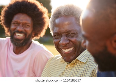 Senior Black Man Laughing With His Two Adult Sons, Close Up