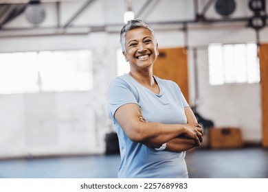 Senior, black woman and gym portrait of a person happy about fitness, training and exercise. Sports, happy and pilates studio of mature female with arms crossed proud about wellness and health - Powered by Shutterstock