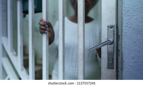 A Senior Black Woman Leaving House Person Opening Front Door