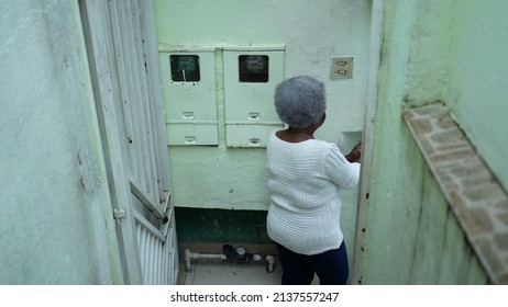 A Senior Black Woman Leaving House Person Opening Front Door